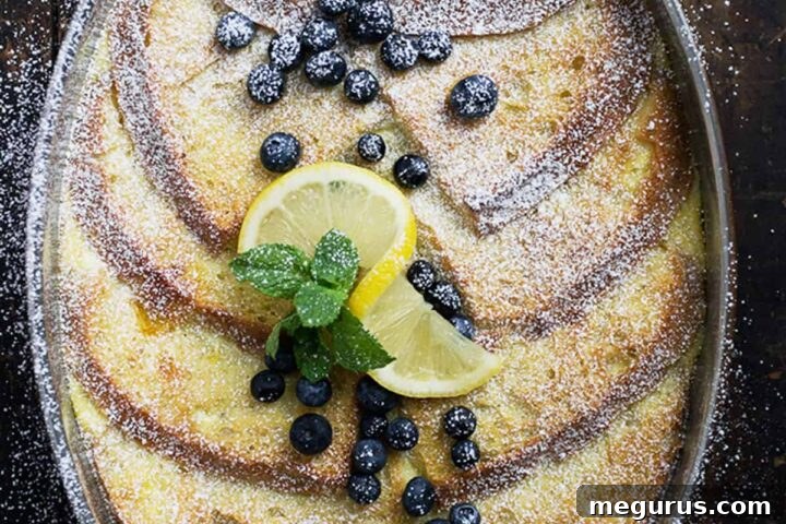 lemon French toast in baking dish with blueberries and lemon slices