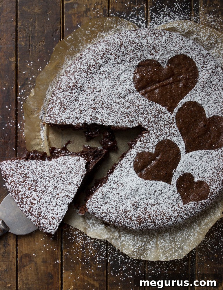 Swedish Gooey Chocolate Cake adorned with a powdered sugar heart design