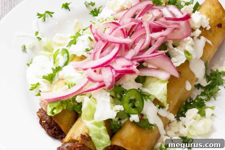 carnitas flautas on plate