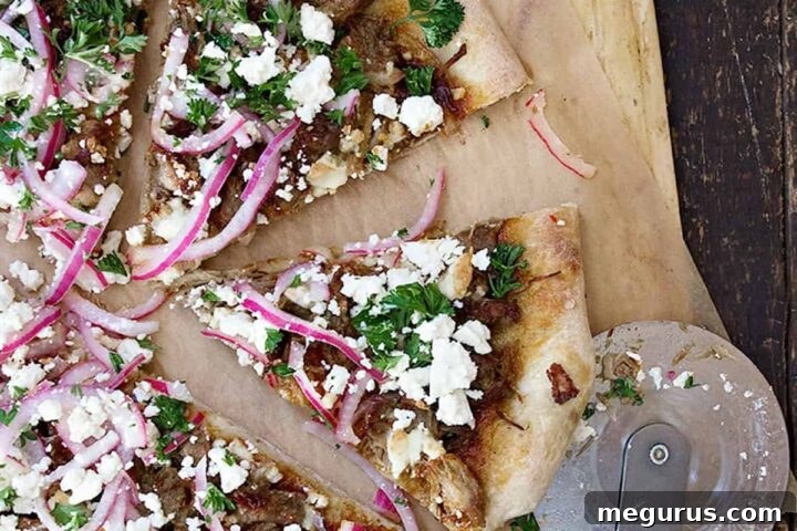 carnitas pizza sliced on pizza peel