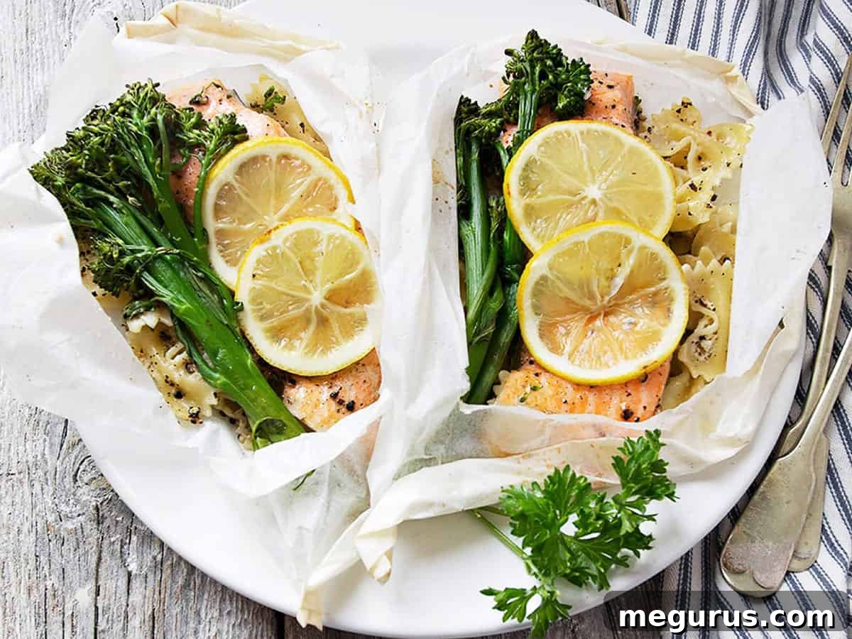 Flaky Rainbow Trout cooked en Papillote with vibrant lemons, tender broccolini, and zesty Parmesan pasta