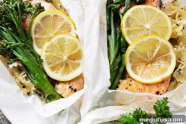 rainbow trout cooked in parchment with lemons, broccolini and pasta