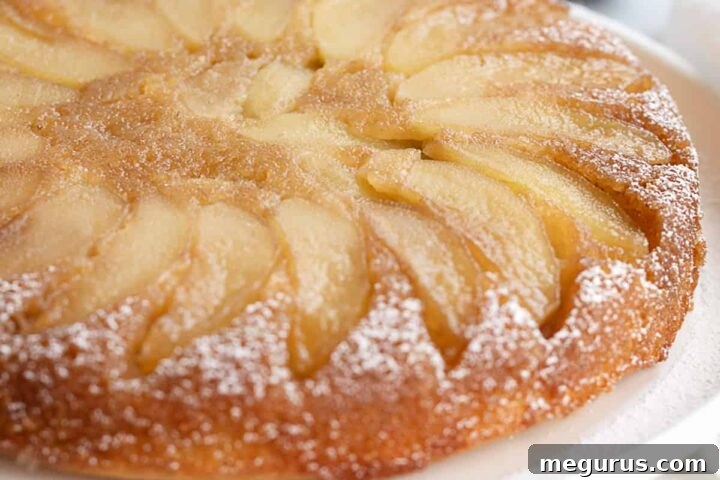upside-down maple apple cake on white plate