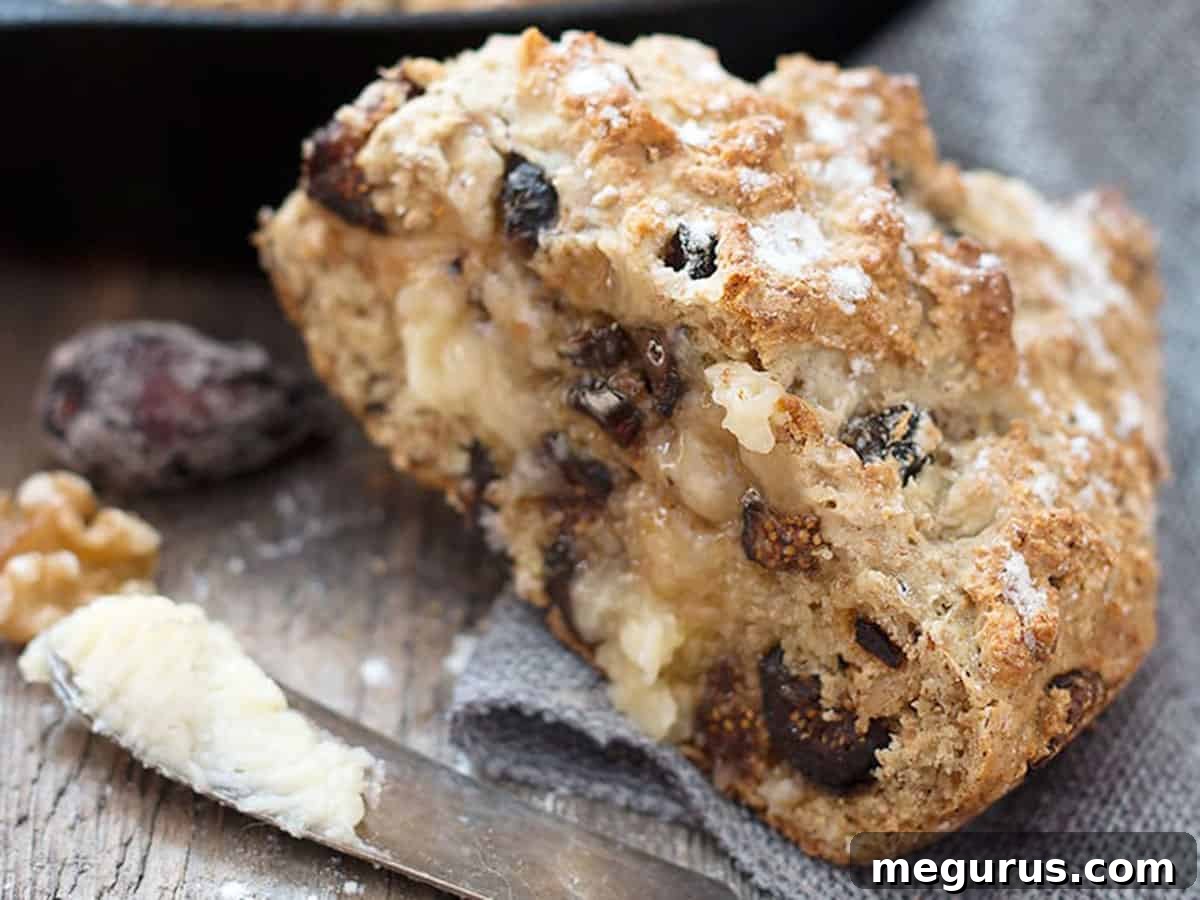 Sliced Fig and Walnut Soda Bread with a knife and butter