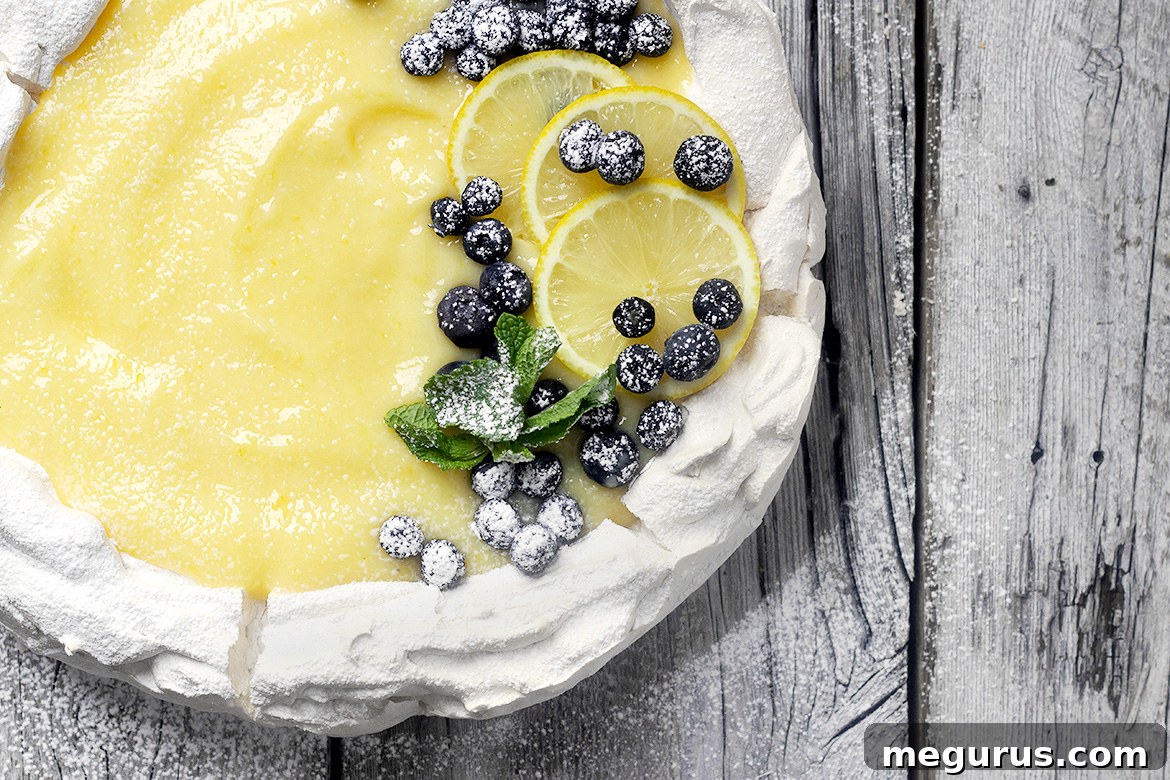 Lemon Curd Pavlova - a perfect Easter dessert with a marshmallow center and crispy outside.