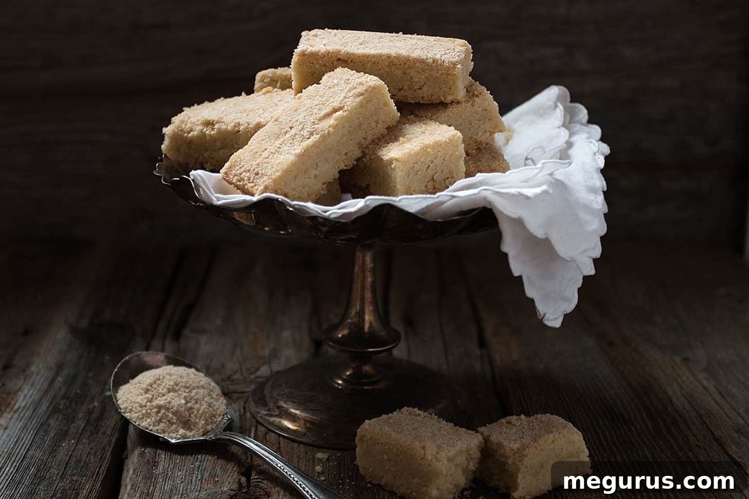 maple sugar shortbread on platter, arranged beautifully on a rustic wooden board with autumn leaves