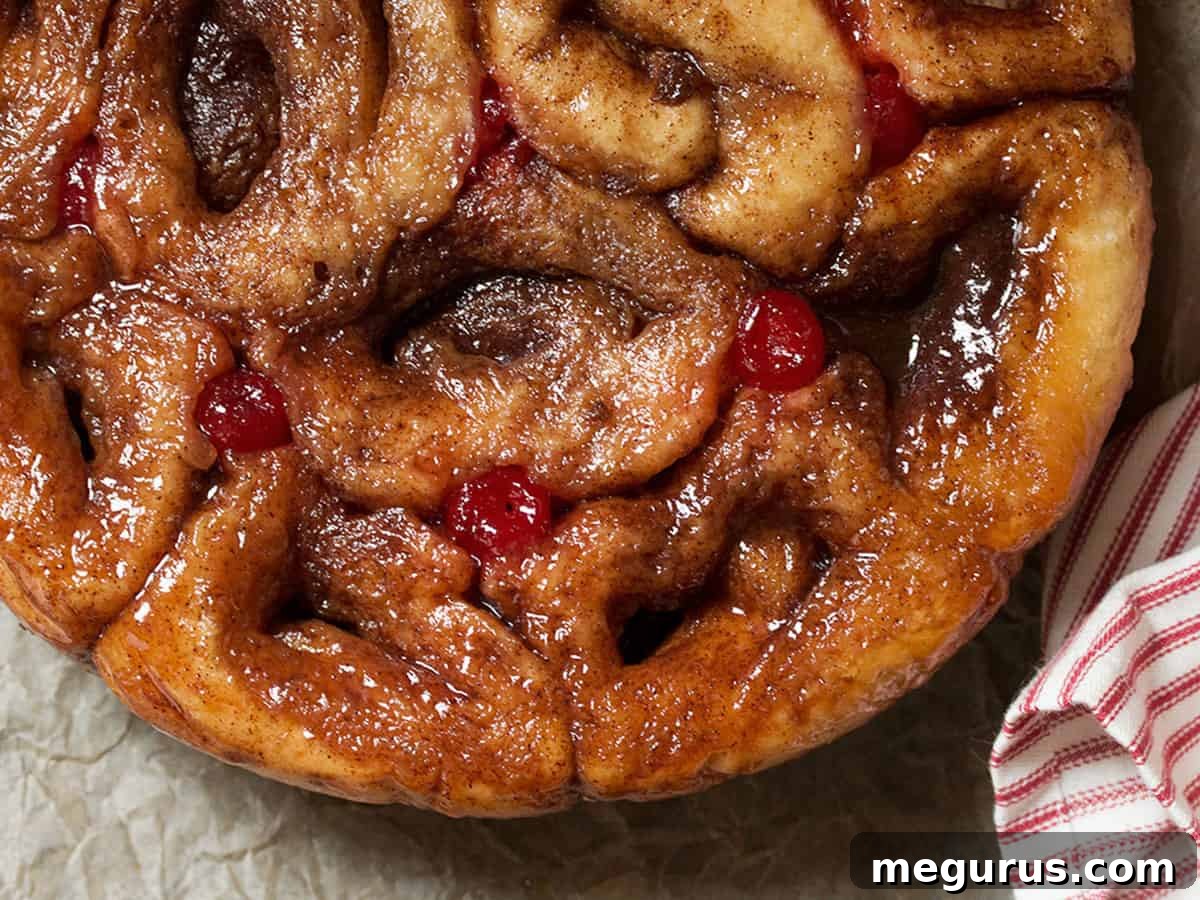 Overhead view of a round pull-apart Chelsea bun loaf, golden brown and sticky