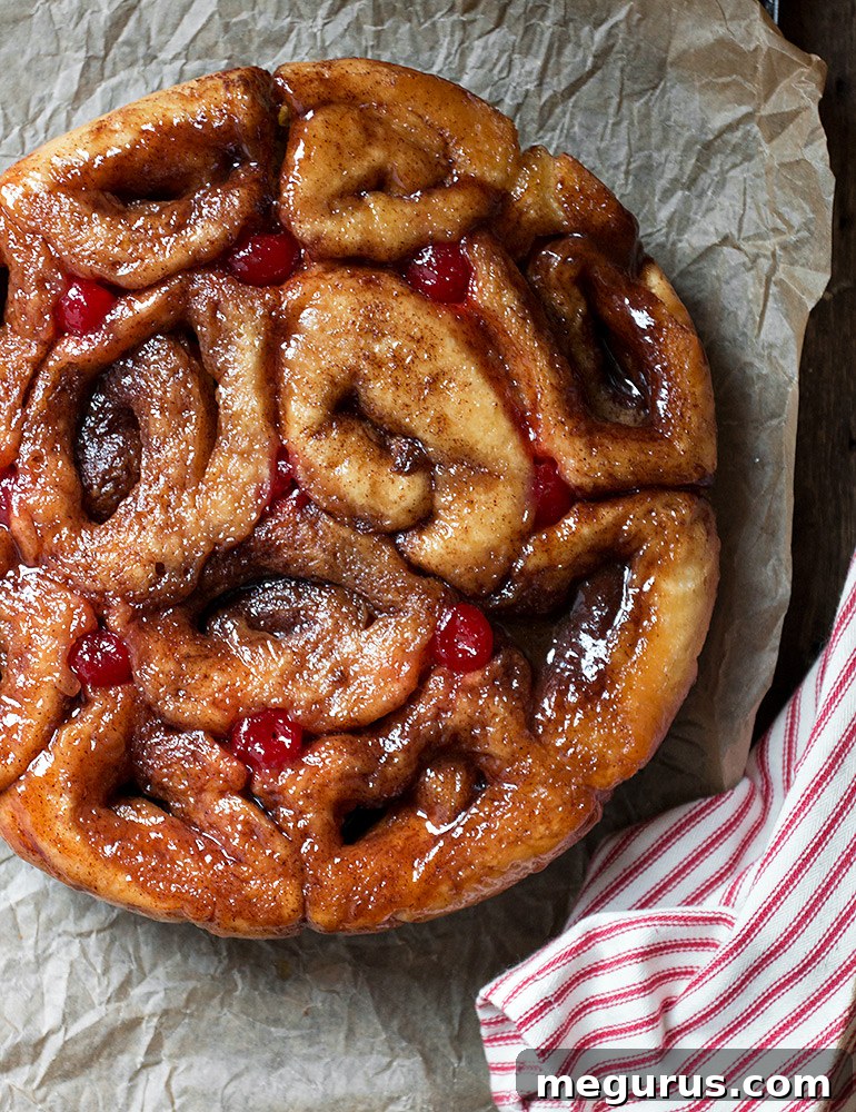 Close-up of freshly baked Muskoka Chelsea Buns showing their sticky topping and fluffy interior
