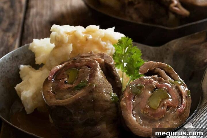 German beef rouladen sliced open in small skillet
