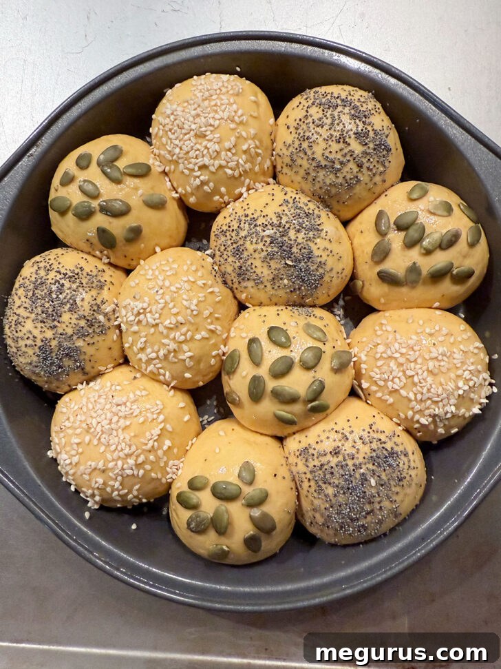 Various seeds scattered on top of the rolls before baking.