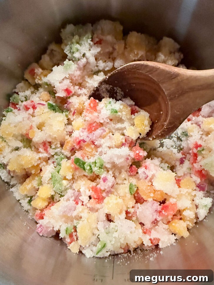 Jelly ingredients being stirred together before cooking to ensure even mixing.