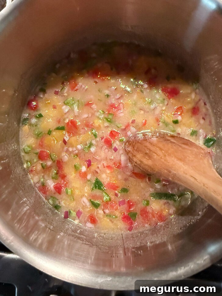 Heating the ingredients in the saucepan over medium-high heat.