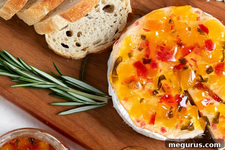 Apricot jalapeño jelly topped Brie with bread.
