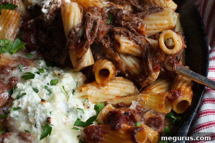 Hearty Brisket Pasta Bake in a cast iron skillet