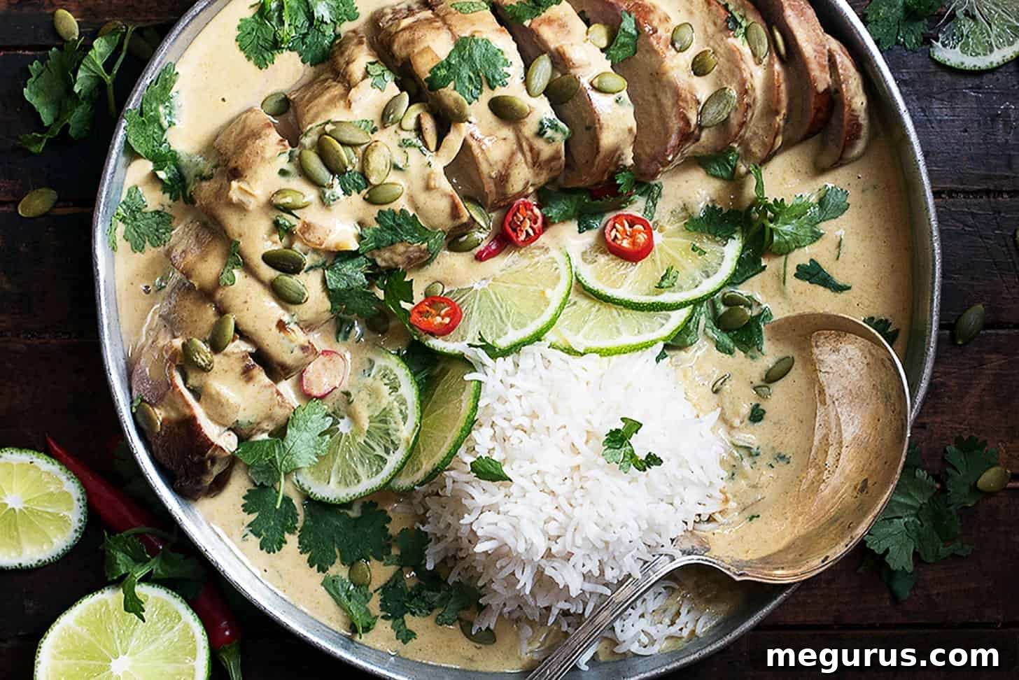 Platter of Thai green curry pork tenderloin with limes and jasmine rice