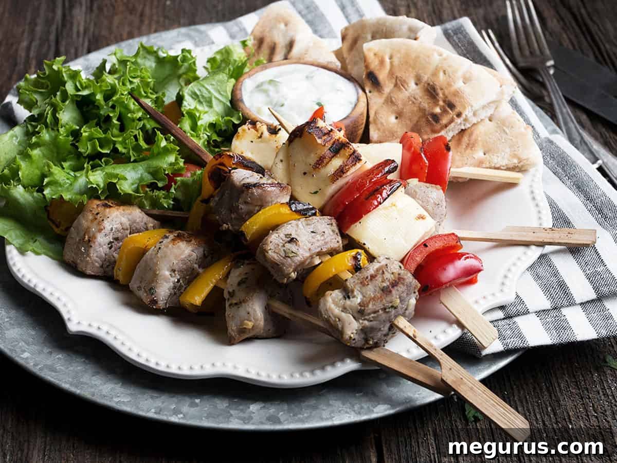 Grilled pork and halloumi skewers with bell peppers and tzatziki