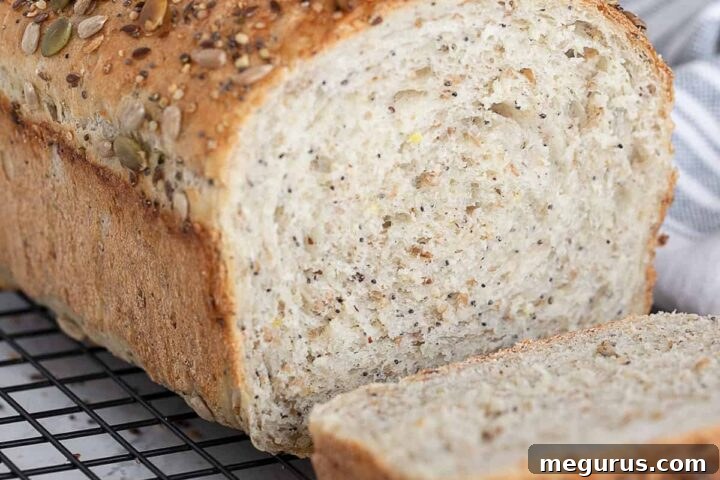 Seeded multigrain bread sliced on cooling rack