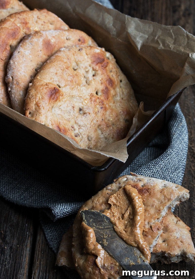 Two Banana Walnut Multigrain Breakfast Rounds on a cooling rack, showcasing their fluffy texture and golden-brown hue.