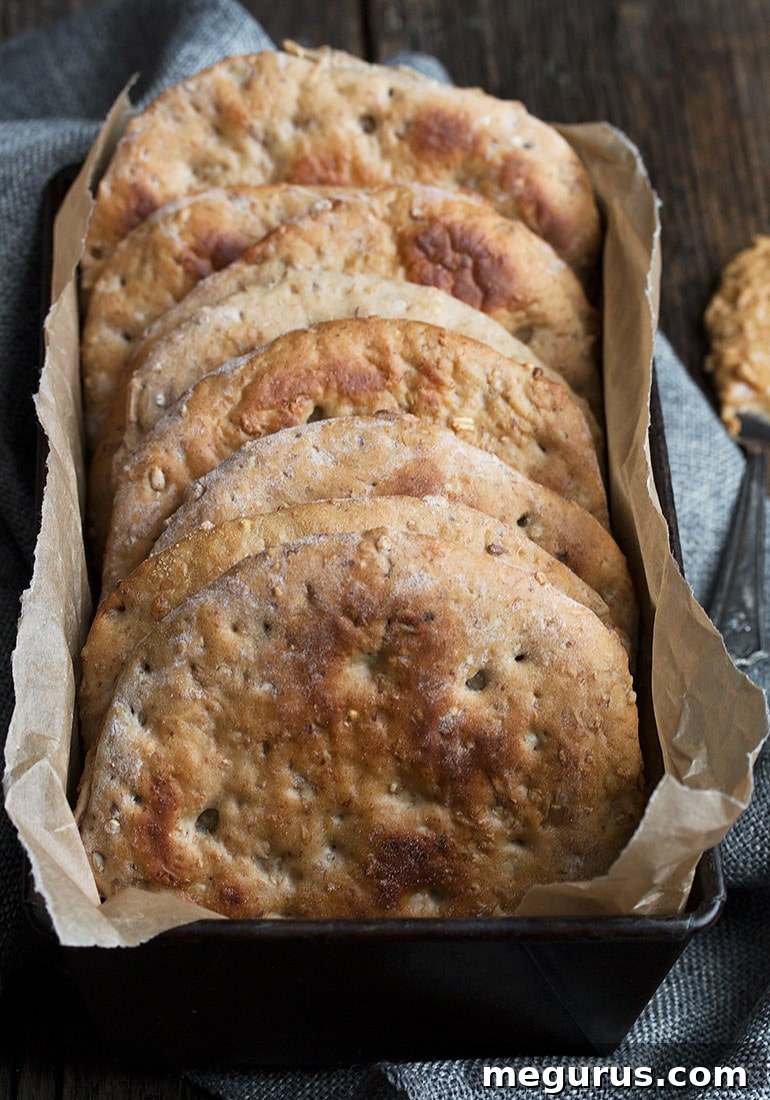 A stack of perfectly golden Banana Walnut Multigrain Breakfast Rounds, ready to be enjoyed.