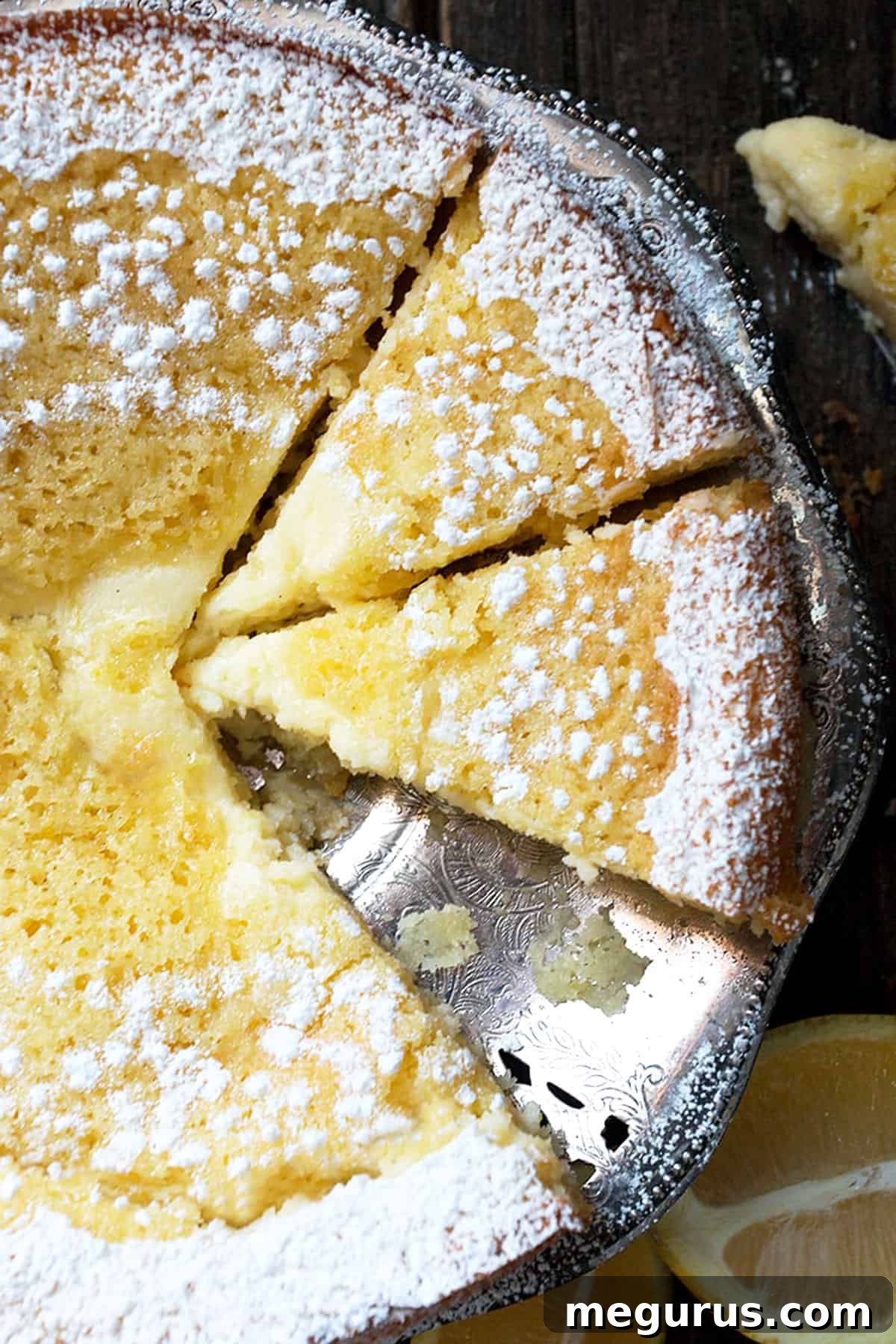 Sliced Lemon Cream Butter Cake on a platter, showcasing the distinct cake and cream cheese layers