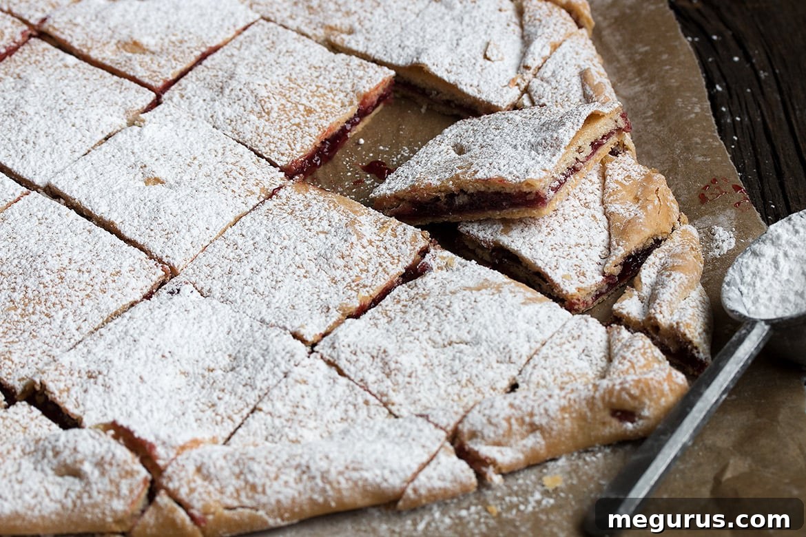 Delicious Raspberry Jam Squares with buttery pastry and jam filling
