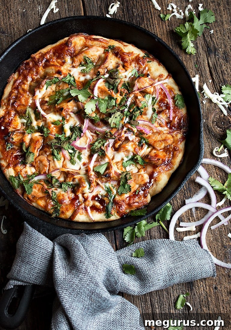 Close-up of a slice of BBQ Chicken Skillet Pizza