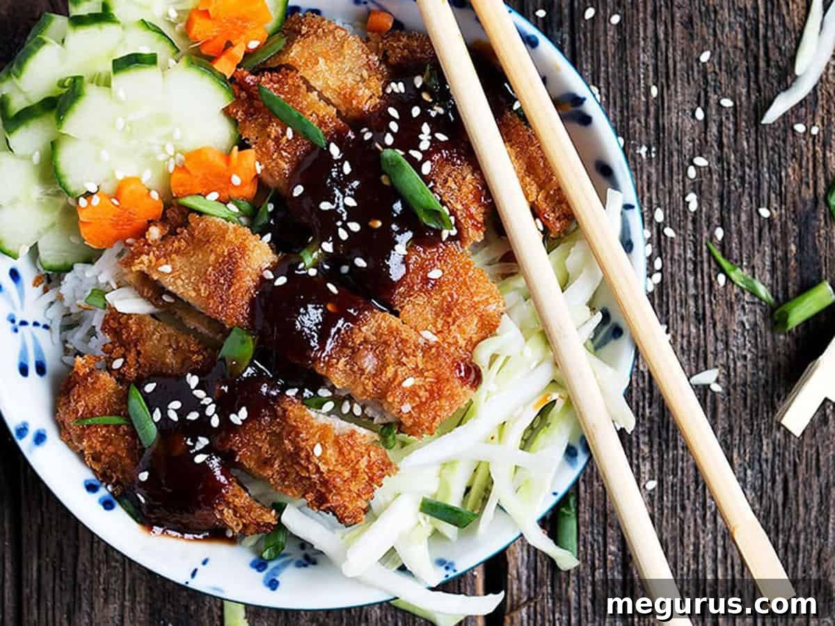 Crispy Pork Tonkatsu Bowls with chopsticks, ready to eat.