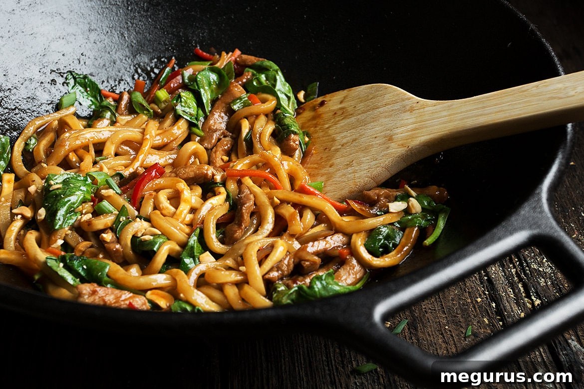 Spicy Pork Udon Noodle Stir Fry, a quick and easy weeknight meal.