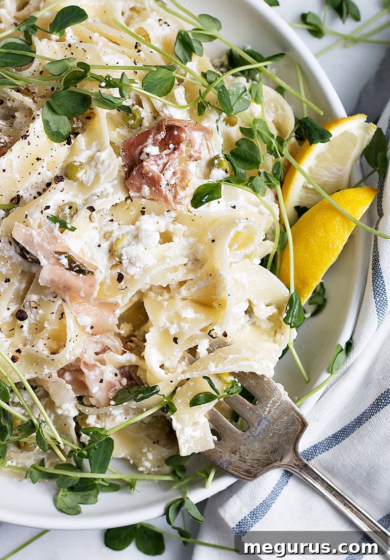 Lemon Ricotta Pasta with Prosciutto and Pea Shoots - close up of a forkful
