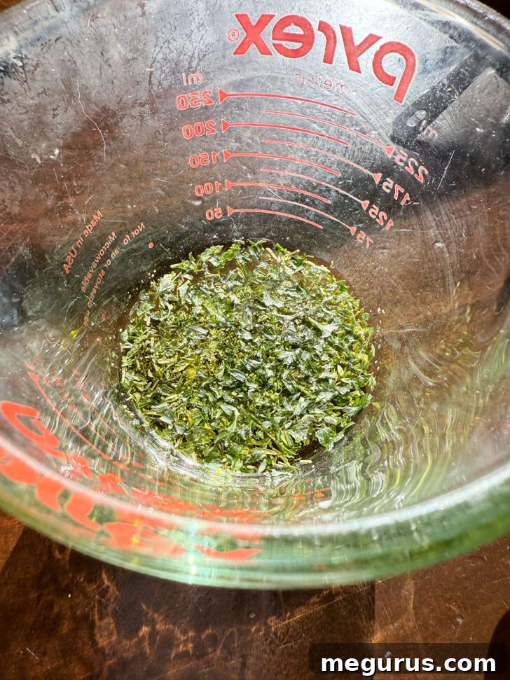 Olive oil mixed with fresh herbs for topping.