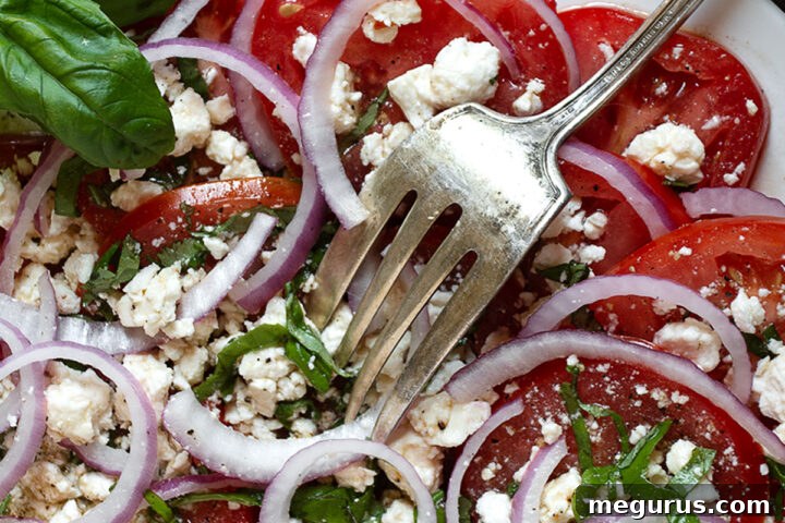 tomato feta salad on white plate
