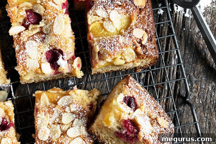 peach melba cake sliced on cooling rack