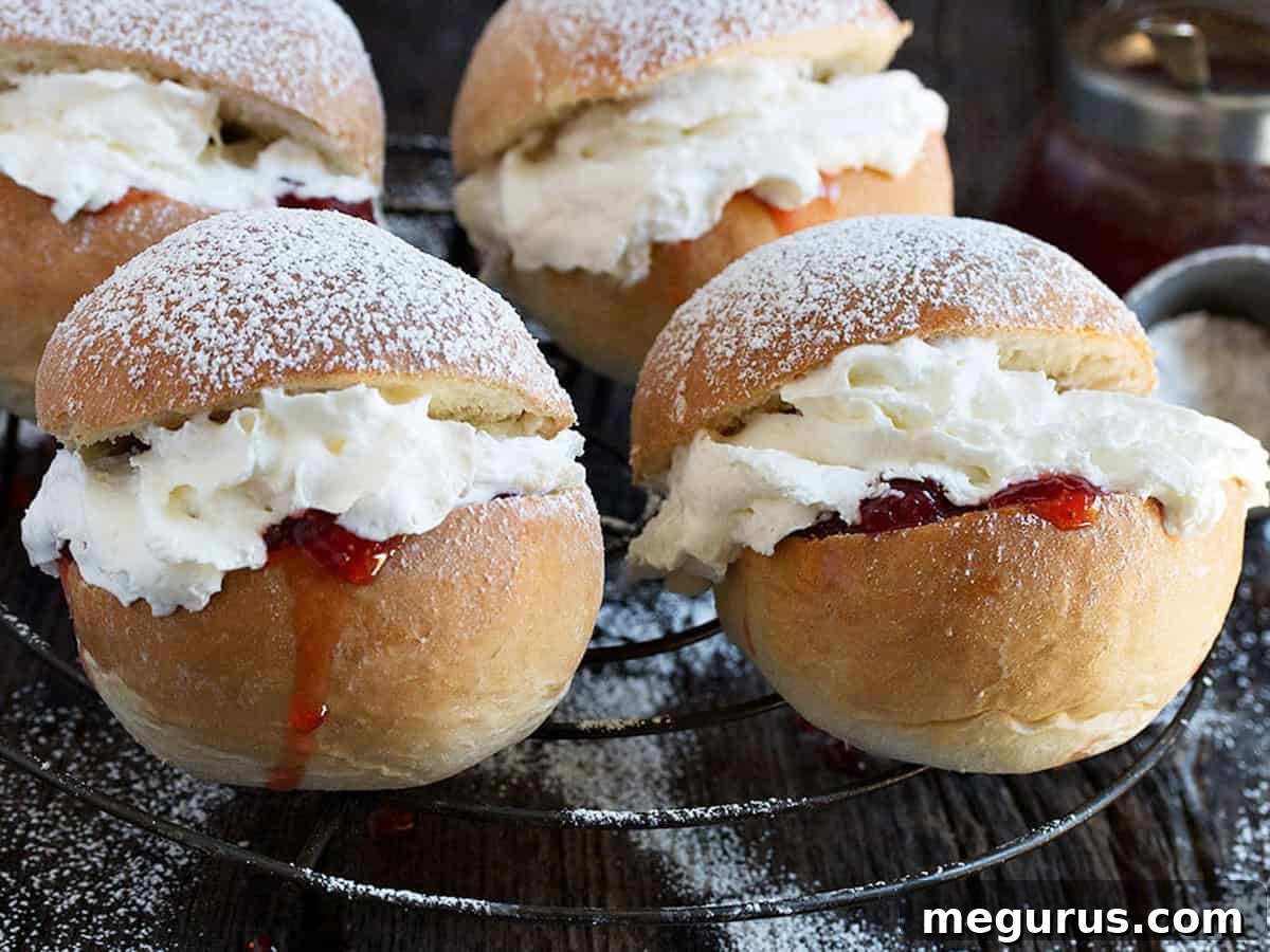 Freshly baked Cornish Splits on a cooling rack, showcasing their golden-brown tops.