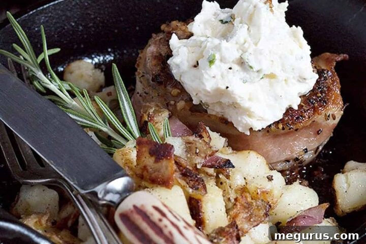 Bacon wrapped pork medallions in a small skillet, ready to be served