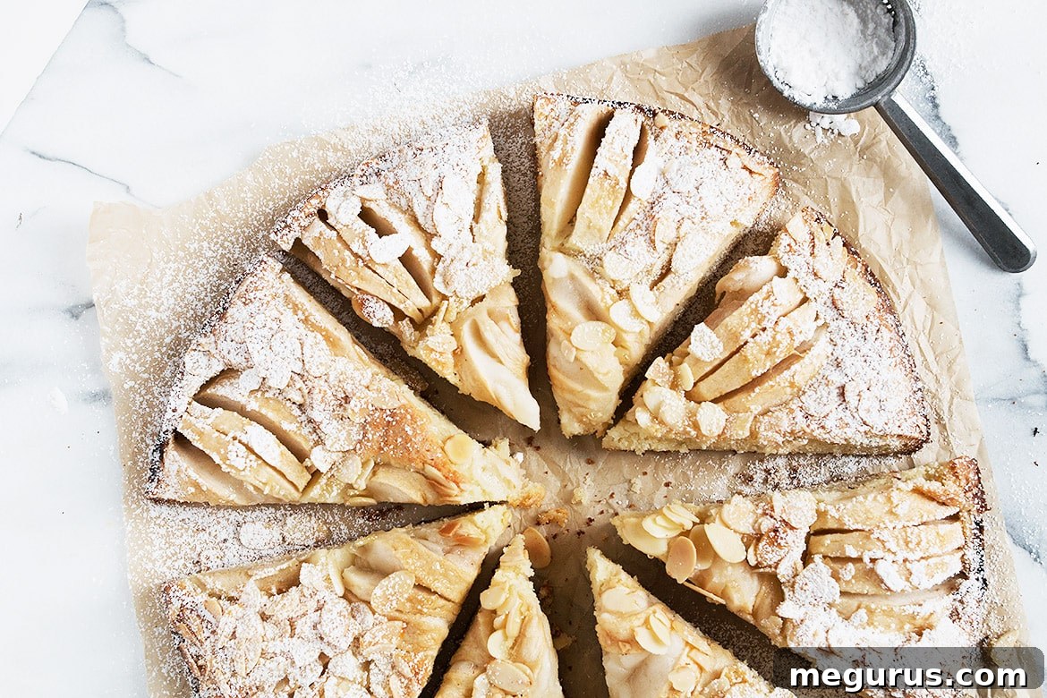 Moist and Flavorful Apple Almond Cake, topped with fresh apples and crunchy almonds