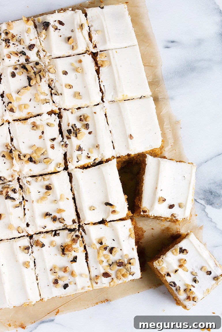 Close-up of a frosted Pumpkin Sheet Cake with Cream Cheese Frosting, ready for serving
