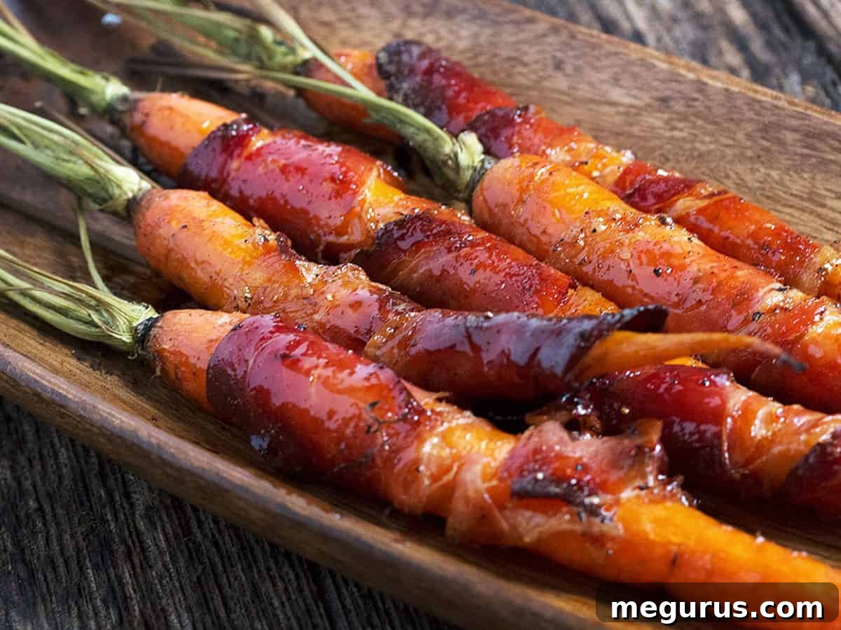 Beautifully arranged maple glazed bacon wrapped carrots in a serving bowl, ready to be enjoyed.