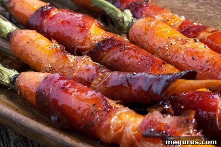 Platter of freshly roasted Maple Glazed Bacon Wrapped Carrots.