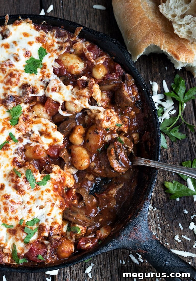 gnocchi and mushroom tomato sauce in a skillet