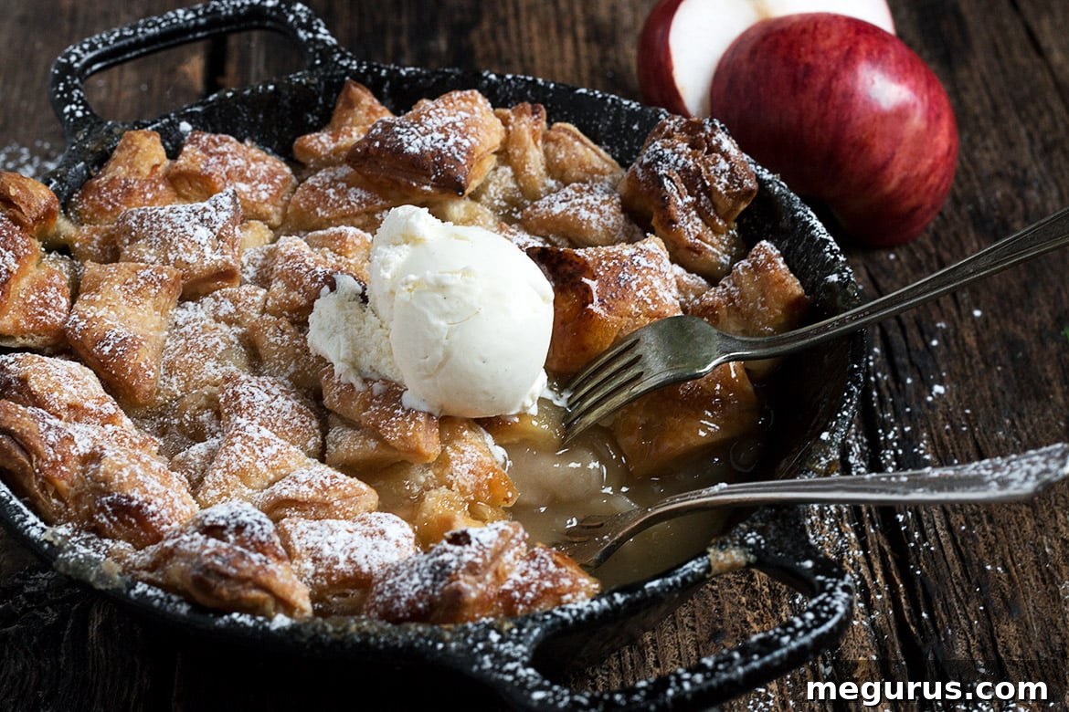Easy Skillet Apple Pandowdy featuring a golden puff pastry topping and warm apple filling