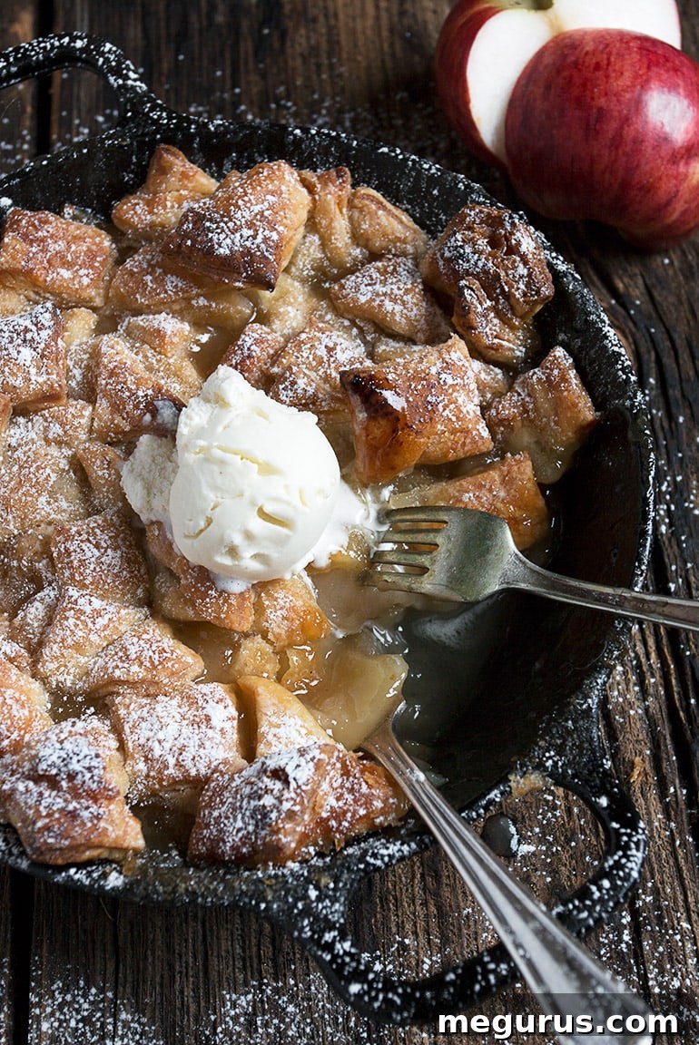 skillet apple pan dowdy topped with ice cream, ready to serve