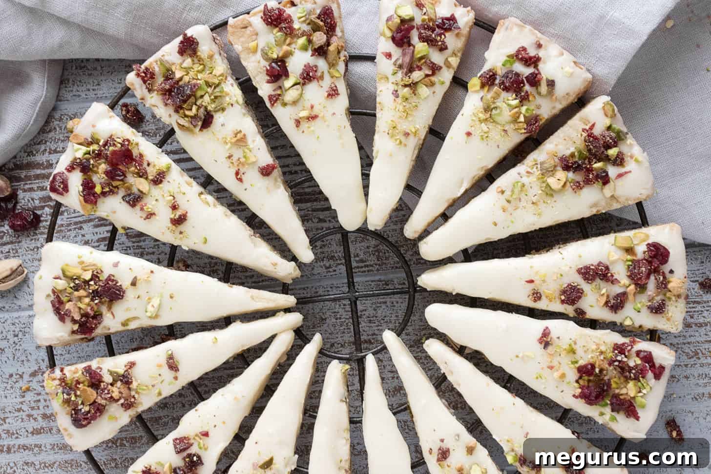 cranberry pistachio shortbread wedges on cooling rack