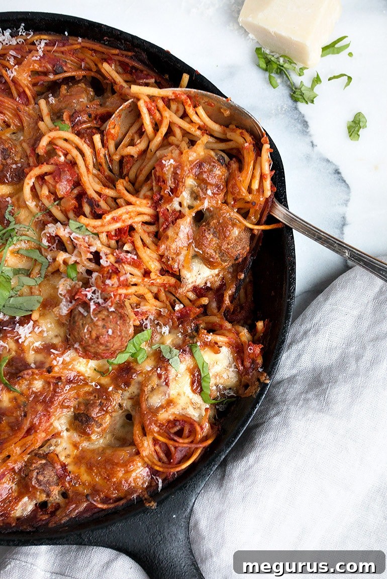 Delicious Baked Spaghetti and Meatballs in a casserole dish, ready to be served