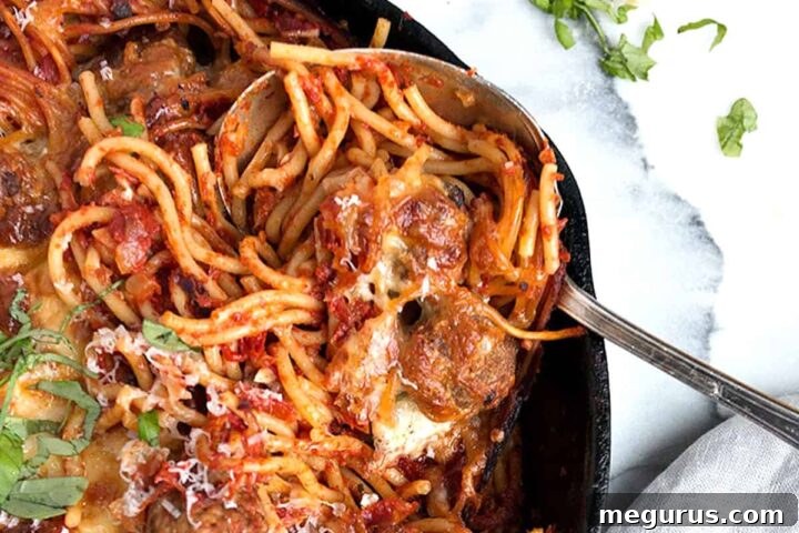 baked spaghetti and meatballs in cast iron skillet
