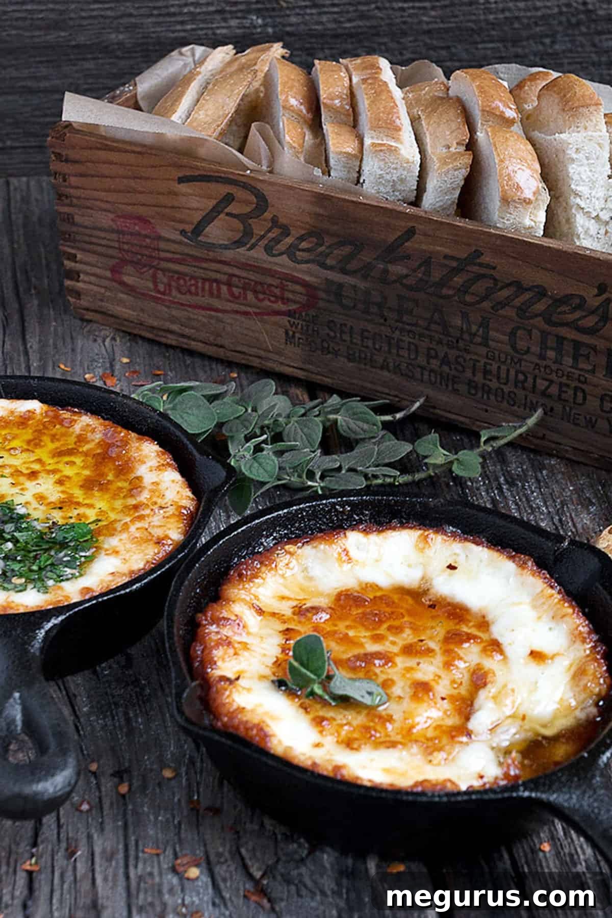 Provoleta: Melted Provolone with various toppings in mini cast iron skillets