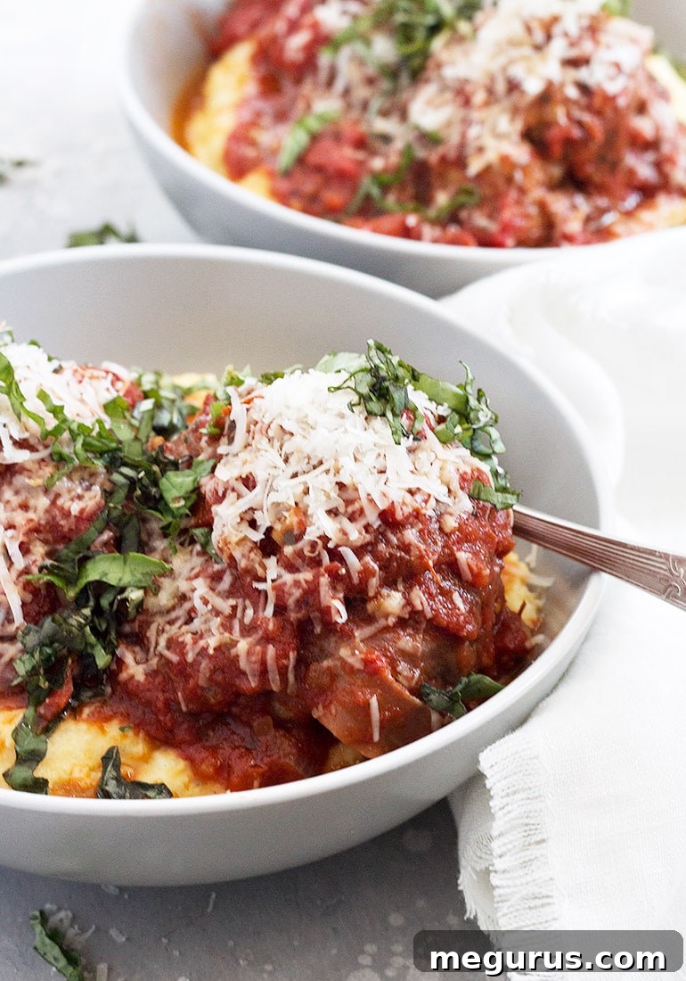 Pork Prosciutto Meatballs and Polenta dish in a bowl, close up.