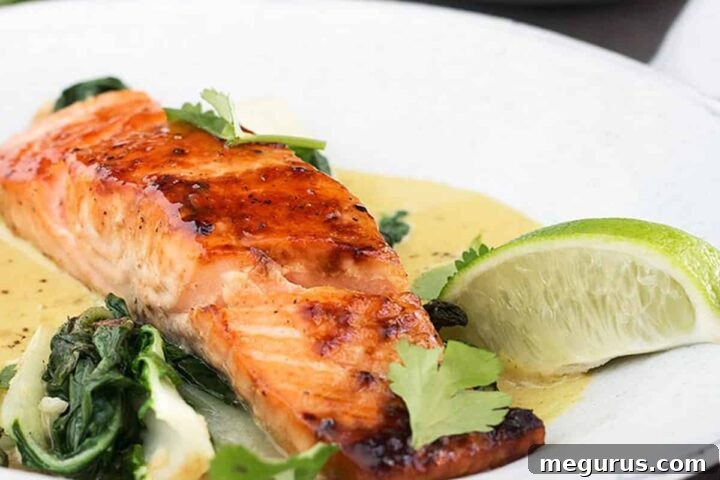 sugar-seared salmon in bowl with coconut lime sauce, ready to serve