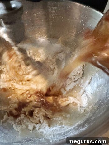The soaked date mixture, including the liquid, is added to the cake batter