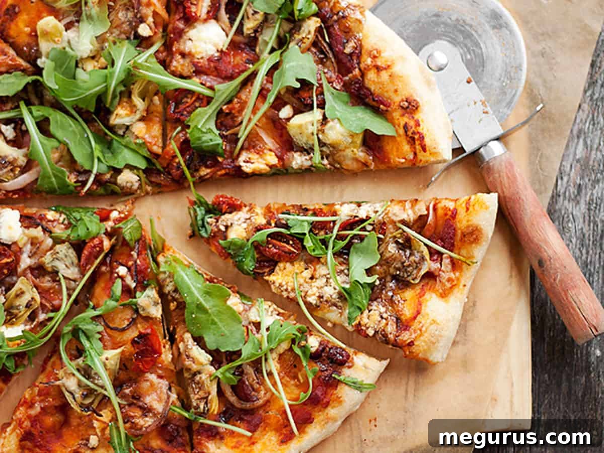 Delicious roasted vegetable pizza with goat cheese and arugula