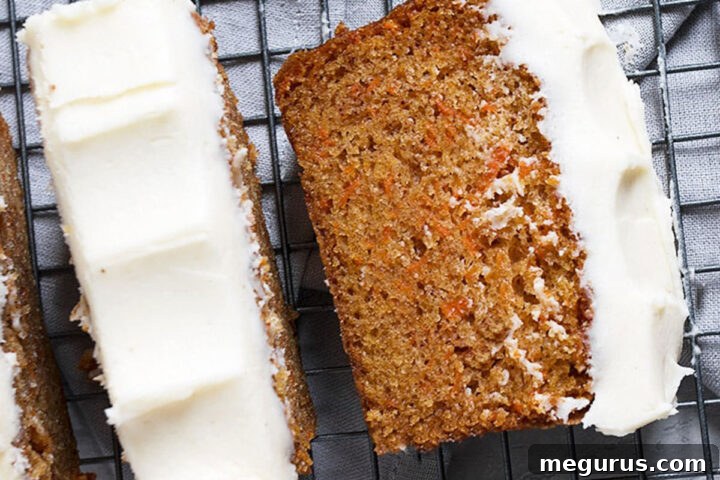 carrot cake loaf with cream cheese frosting sliced